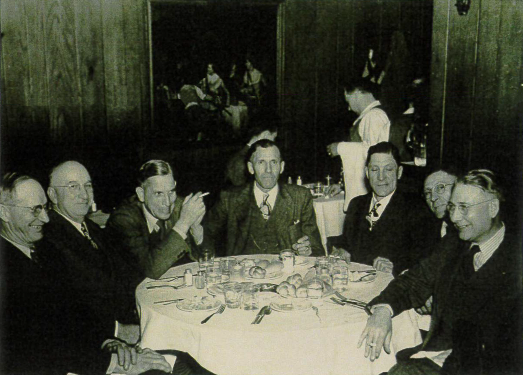 Pictured at the Builders Show in Chicago, Illinois on February 22, 1950, from left to right: Earl Mickelsen, William Rowe, Stanley Nielsen, Gotthard Sarman, Walter VanGerpen, Charles Engel, and Alfred Christensen